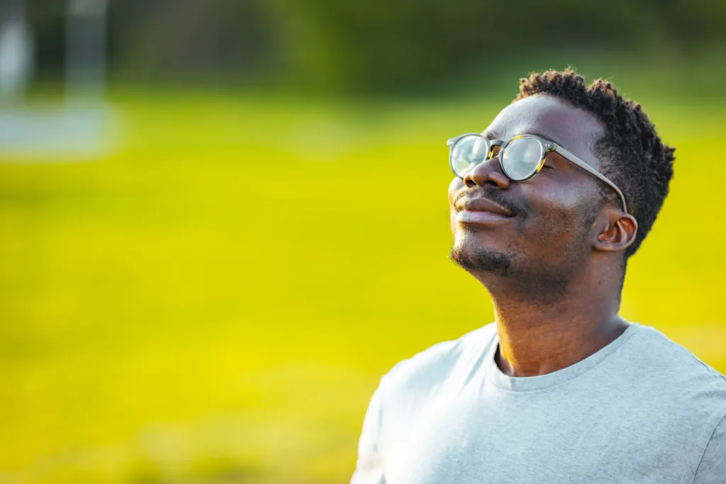 Relaxed man breathing fresh air.