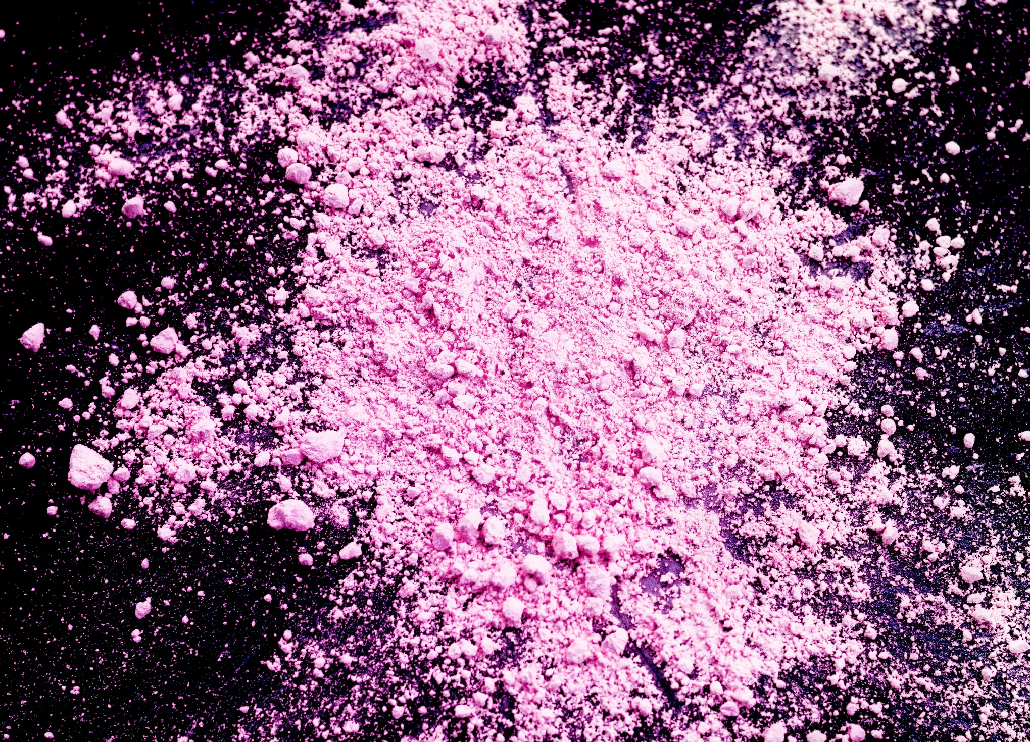 Pile of pink cocaine or tuci on black background