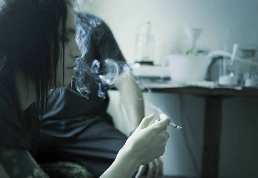 Two people smoking pink meth